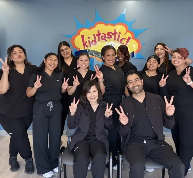 Smiling Kidtastic Pediatric Dental staff team photo.